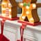 Glitzhome® Marquee LED Gingerbread House & Gingerbread Man Christmas Stocking Holder Set